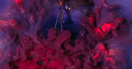 Particles paint. Smoky flow. Shimmering hypnotic pink purple current wavy mixing in sparkling water. Cloudy smooth color stream background.