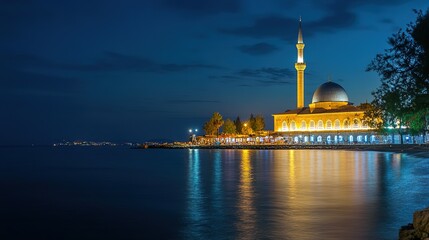 Fototapeta premium Beautiful Mosque with Minaret at Beach Coast at Night, Right Space for Text Caption