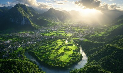 Sunset over valley town, river bends through green landscape, mountains backdrop; travel brochure