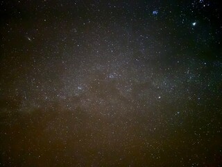 A minimalistic night sky featuring a single bright star, standing out against the deep blue expanse