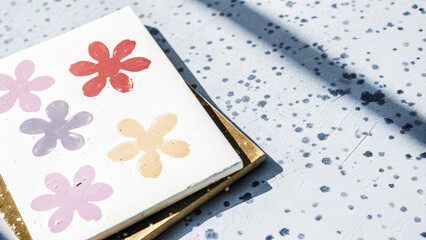 Hand-painted abstract flower shapes on canvas for Women's Day