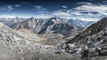 Breathtaking Mountain Landscape with Rugged Terrain and Dramatic Sky Under Clear Blue Atmosphere