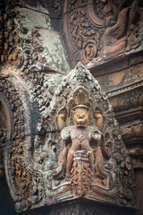 Decorative artwork at Banteay Srei, the Citadel of Women, a red sandstone Hindu temple in Angkor, Cambodia