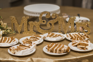 wedding cake cut up into slices and served