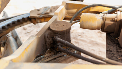Close-up inspection of hydraulic systems in urban construction equipment