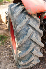 Tractor tire close-up farm field rural environment ground level agriculture insights