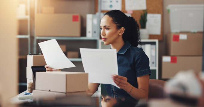 Woman, logistics or documents with invoice for shipping cost or delivery expense at warehouse. Female person, distributor or inspection with paperwork for supply chain, budget or checking references