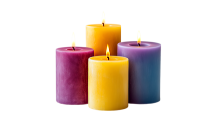 Four lit candles in purple and yellow hues burning brightly against a black background