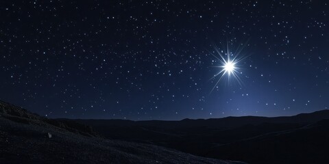 Bright Star Over Dark Mountainous Landscape At Night