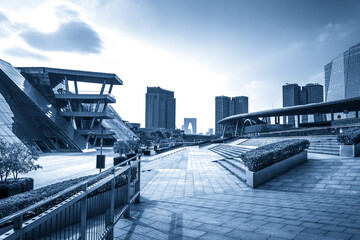 Sleek Modern Cityscape with Innovative Architecture Under Cloudy Sky