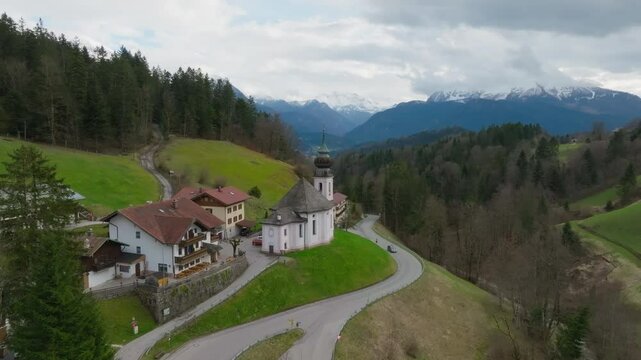 Aerial of Historical Maria Gern catholic church at the foothills of Bavarian alps in German village, Berchtesgaden, Bavaria, Europe