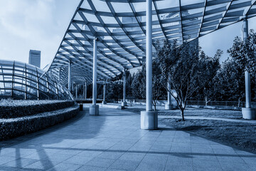 Serene Urban Pathway Under a Modern Architectural Canopy