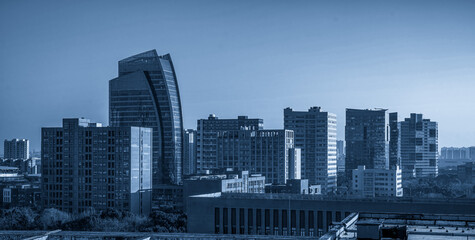 Modern Urban Skyline in Blue Hue: A Contemporary Cityscape