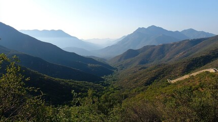 Fototapeta premium A panoramic view of the Great Wall in mountainous terrain
