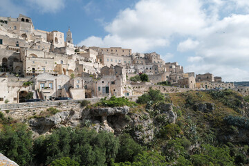 Fototapeta premium Exterior aerial architecture and design at 'MATERA' Italian ancient cave dwellings inhabited since the Paleolithic, UNESCO World Heritage Site- Italy