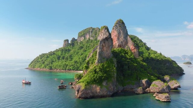Experience a breathtaking and stunning aerial view of the beautiful Ko Po Da Nok island in Thailand, showcasing a longtail boat beneath a dazzling starry sky
