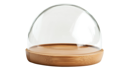 Empty glass dome covering wooden tray on transparent background