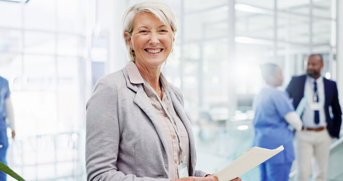 Portrait, mature or happy woman with documents at hospital for medical funding, campaign or development. Female person, board director or health manager with smile or paperwork for healthcare program