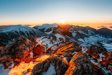 Naklejka premium Winter hiking to Velky Rozsutec in Mala Fatra National park is full of beautiful views. Sunset in Slovakia mountains. Slovakia landscape