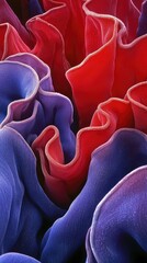 Obraz premium Abstract red blue fabric waves, close-up texture, background blur, design wallpaper