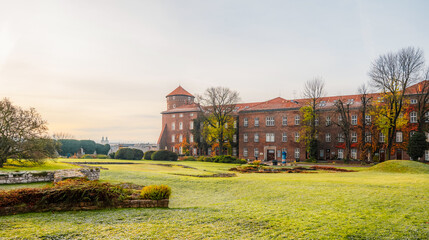 Wawel castle landmark with city view near river in Krakow Poland. Autumn landscape on coast river...