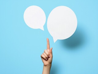 Finger pointing to two speech bubbles.