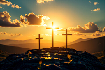 Good Friday and Easter:Jesus Christ, there are three crosses on the rock, with dramatic sunlight shining in the background.