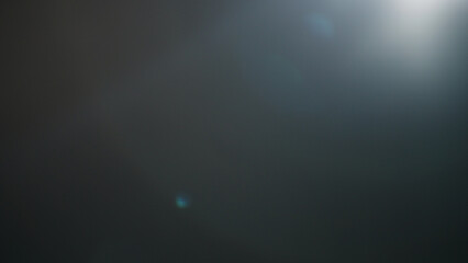 Real lens flare from optics with bokeh and obstruction on foreground