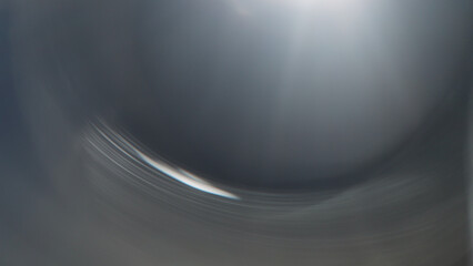 Real lens flare from optics with bokeh and obstruction on foreground
