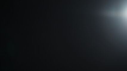 Real optic lens flare over black background for overlay or background