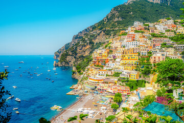Positano coastline in south of Italy, vertiginous cliffs adorned with colorful villages, turquoise...