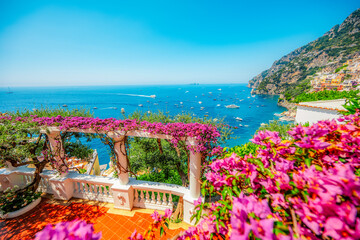 Positano coastline in south of Italy, vertiginous cliffs adorned with colorful villages, turquoise waters. Small town Positano on Amalfi Coast near Neapol, Italy