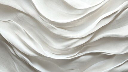 Fototapeta premium A close-up of flowing white fabric, showcasing soft, textured waves and elegant draping.