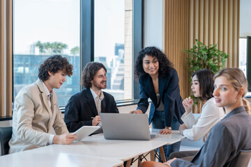 group of multiracial business colleagues meeting in the office,discussing on table in a conference room.,collaborating happy business people