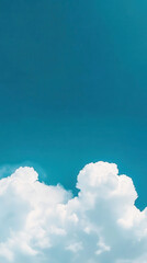 Serene blue sky with fluffy white clouds