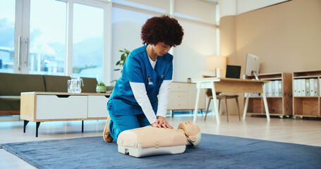 Nurse, cpr or woman training on mannequin for first aid practice, cardiac arrest or safety protocol. Healthcare class, medical simulation or heart attack rescue in paramedic course or nursing school