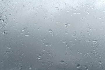 Raindrops on window glass. Rainy weather.