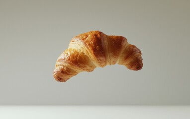A single croissant floating in mid-air against a pure white background, captured with crisp details and soft shadows.