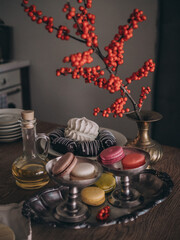 Desserts on the table in a vintage kitchen. Dark atmospheric photo