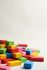 A Colorful Collection of Interlocking Blocks Arranged in a Casual Pile on a Light Background