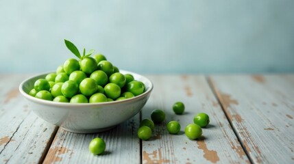 A bowl of fresh green plums rests on a rustic wooden surface, some additional plums scattered nearby, suggesting a simple, healthy, and natural snack.