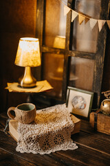 Cozy Vintage Still Life with Ceramic Cup and Warm Light