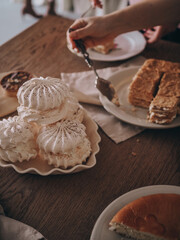 Desserts on the table in a vintage kitchen. Dark atmospheric photo