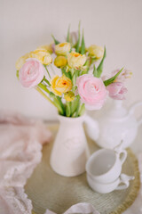 Soft Spring Table Setting with Pastel Flowers and Vintage Decor