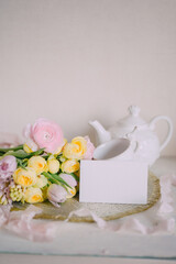Mockup card on Soft Spring Table Setting with Pastel Flowers 