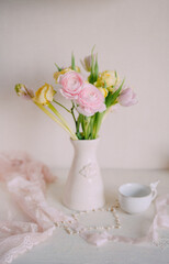 Soft Spring Table Setting with Pastel Flowers and Vintage Decor