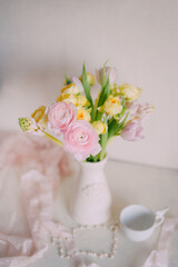 Soft Spring Table Setting with Pastel Flowers and Vintage Decor