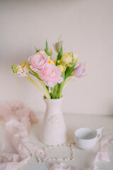 Soft Spring Table Setting with Pastel Flowers and Vintage Decor