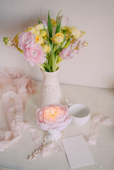 Soft Spring Table Setting with Pastel Flowers and Vintage Decor
