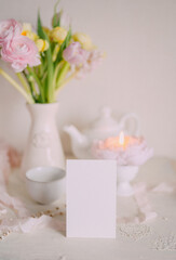 Mockup card on Soft Spring Table Setting with Pastel Flowers 